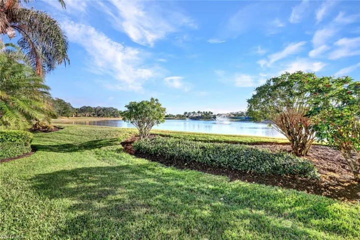 View of yard with a water view
