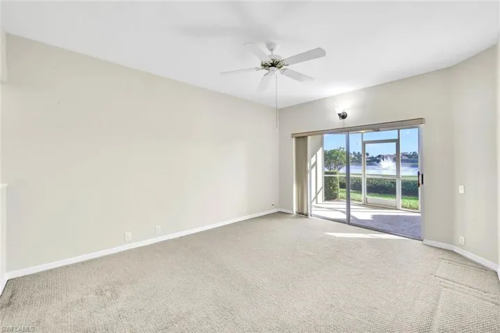 Empty room with carpet and ceiling fan