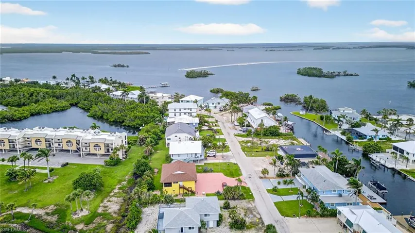 Aerial perspective of suburban area with a large body of water