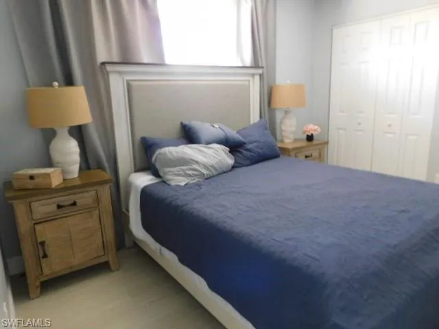 Bedroom featuring a closet and wood finished floors