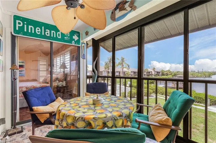 Sunroom featuring ceiling fan