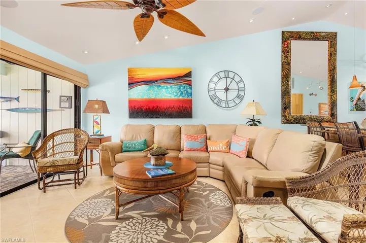 Living room featuring tile flooring and ceiling fan