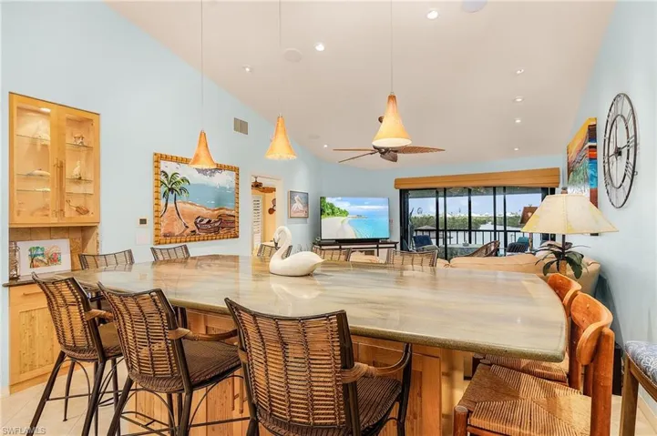 Dining space featuring vaulted ceiling and ceiling fan