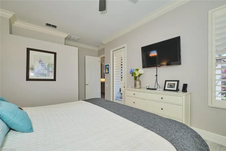 Bedroom featuring crown molding and ceiling fan