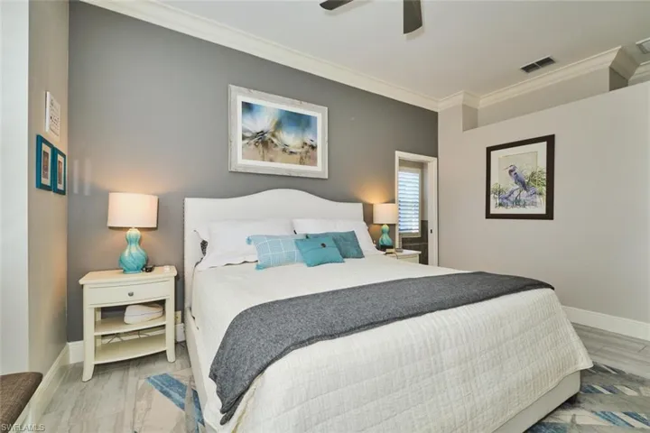 Bedroom with crown molding and ceiling fan