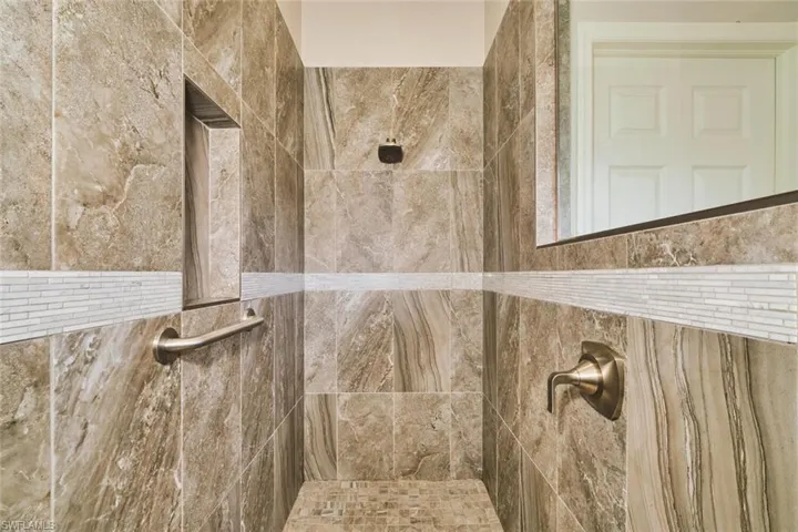 Bathroom featuring a tile shower