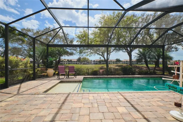 Swimming pool with a lanai, a patio, and a sunroom