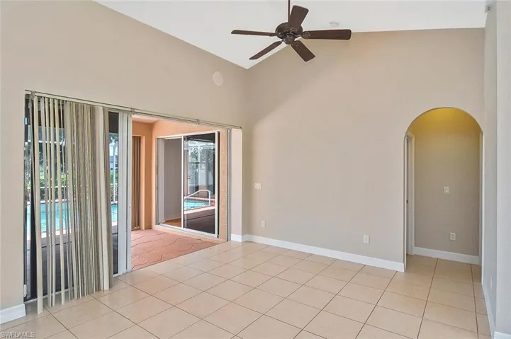 Living Room with Pocket Sliding Glass doors to Pool Area and Cathedral Ceilings