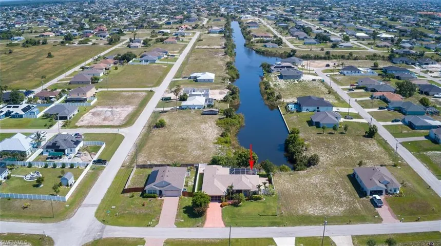 Birds eye view of property featuring a long water view