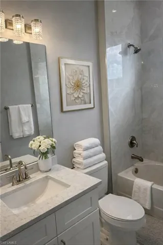 Full bathroom with vanity and shower / washtub combination