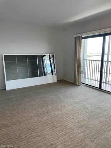 Empty room featuring carpet