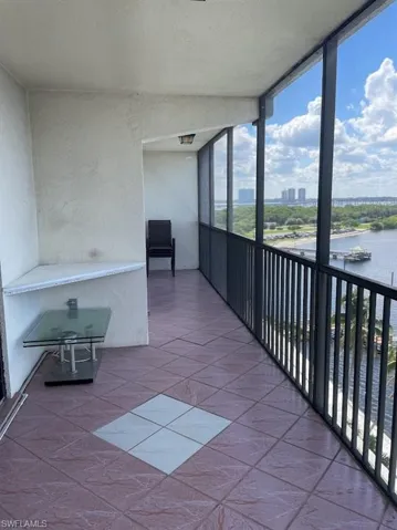 Unfurnished sunroom with a water view