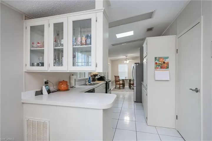 Bright white cabinetry in kitchen