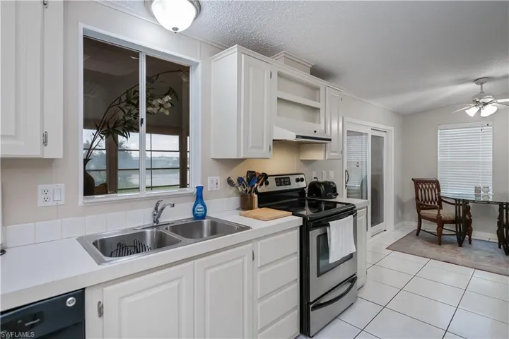 Window in kitchen overlooks lake