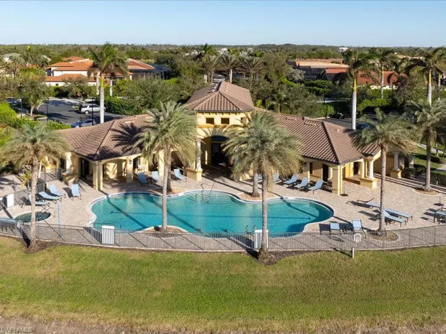 View of swimming pool featuring a lawn and a patio area