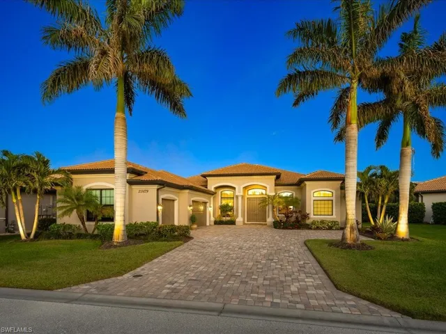 Mediterranean / spanish-style house with a front yard