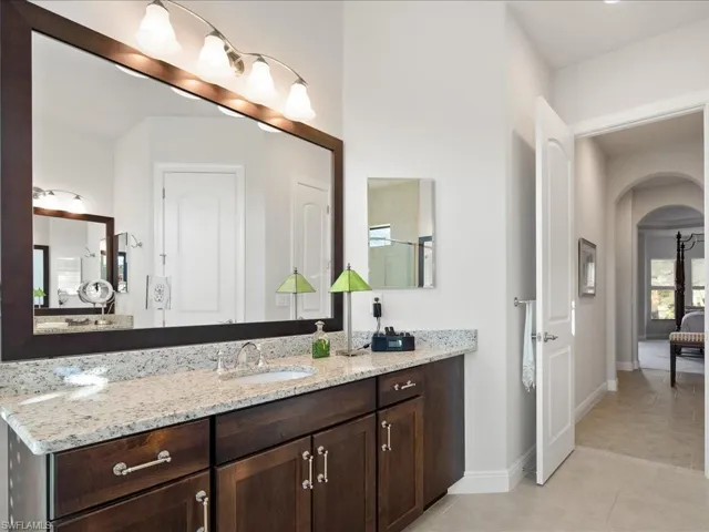 Bathroom with vanity and tile patterned floors