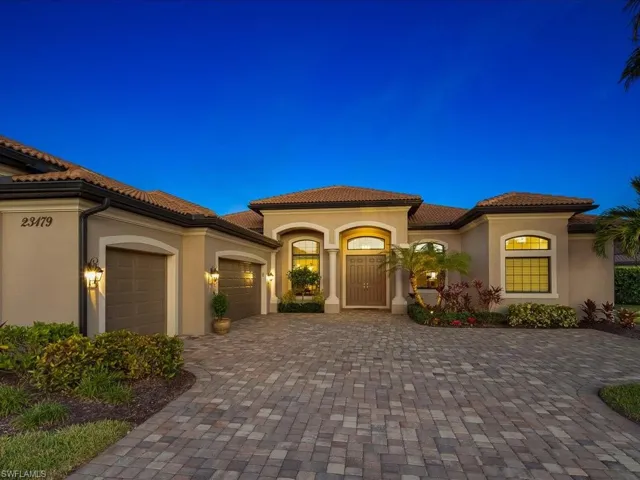 Mediterranean / spanish-style home with a garage