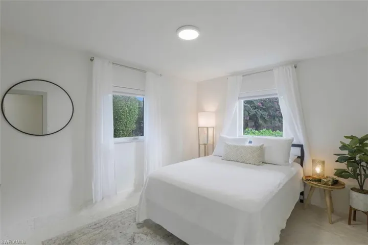 Bedroom featuring multiple windows