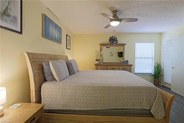 Bedroom featuring light wood-finish flooring and light yellow wall paint