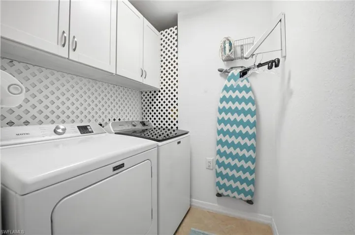 Very functional laundry room with additional storage