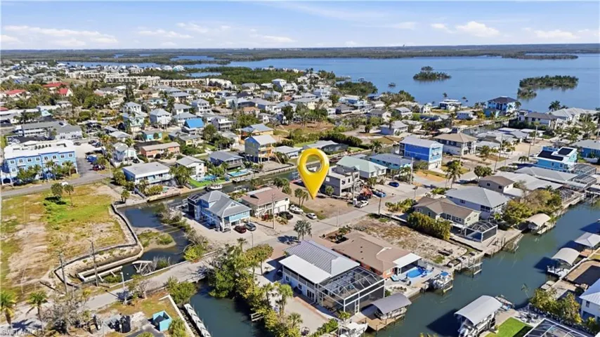 Aerial perspective of suburban area with a large body of water - Virtually Edited Image