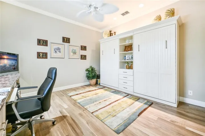 Guest bedroom with Murphy Bed also being used as an office