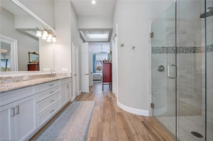Master Bathroom with walk in tile shower and custom mirrors