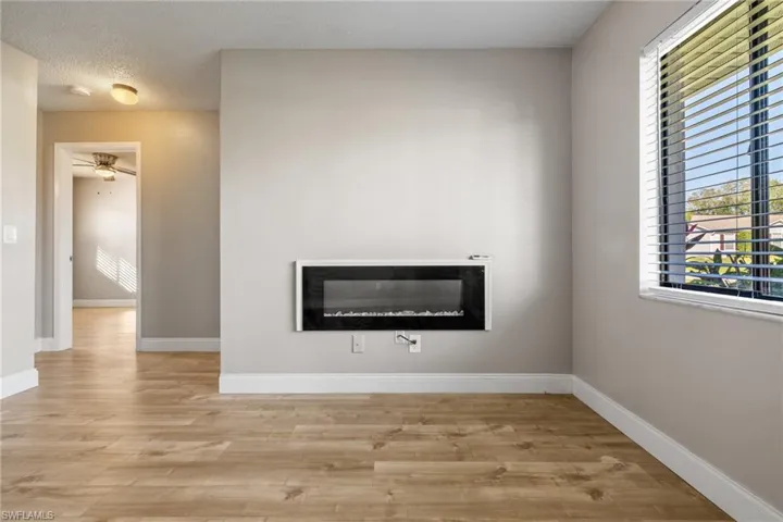 Details with hardwood / wood-style floors, a textured ceiling, and ceiling fan