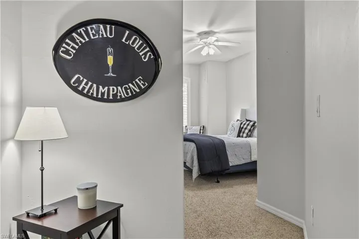 Bedroom with light carpet and ceiling fan