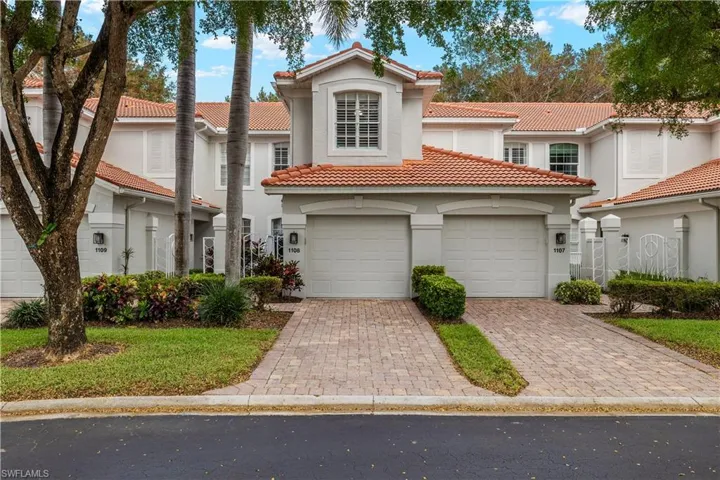 Front of Carriage Home Featuring One Car Garage