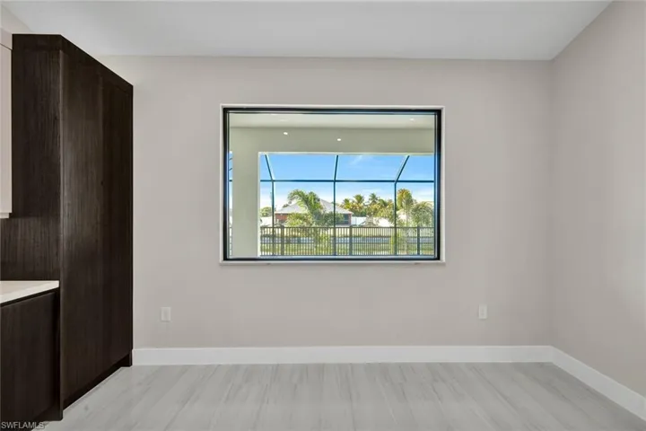 Unfurnished dining area with baseboards