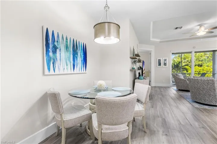 Cozy dining nook! Custom lighting.