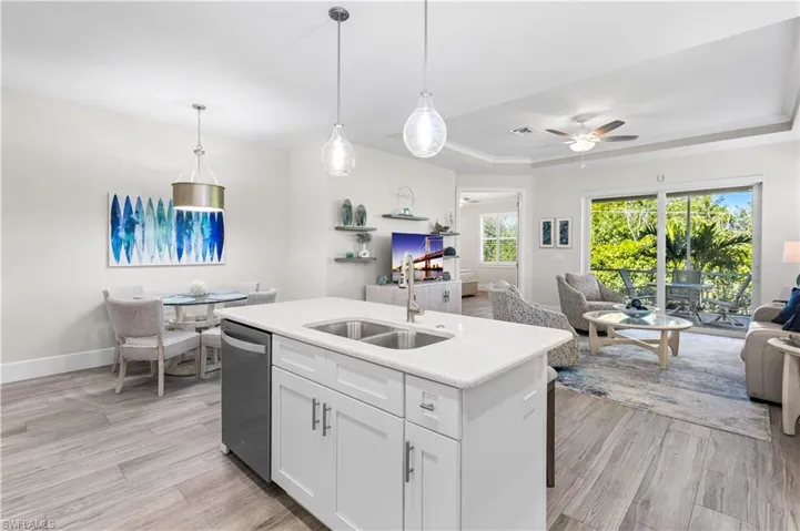 Dining nook across from kitchen island. Serene views of the preserve. Wonderful open flowing concept.  Great for entertaining!