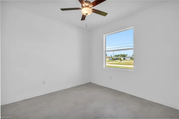Spare room featuring ceiling fan