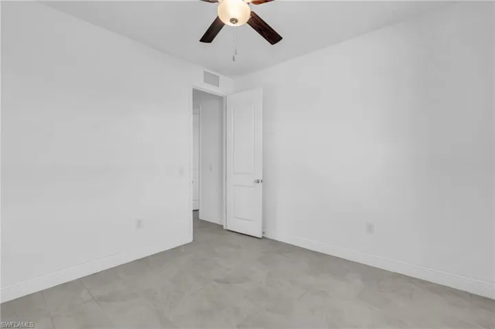 Empty room featuring ceiling fan