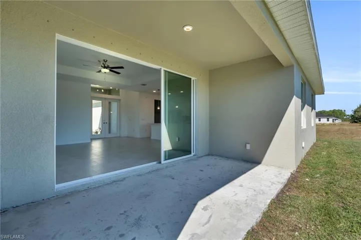Doorway to property featuring a patio area and french doors