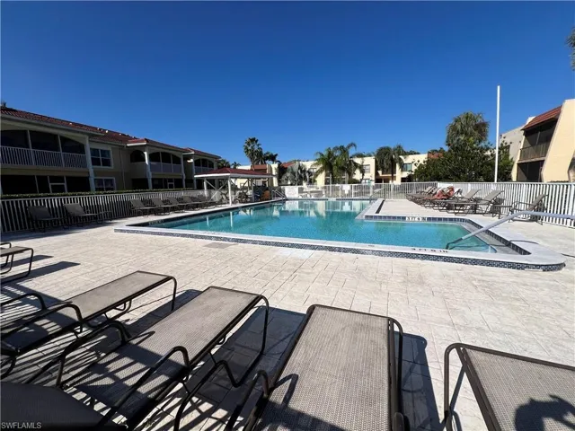 Community pool with a patio area
