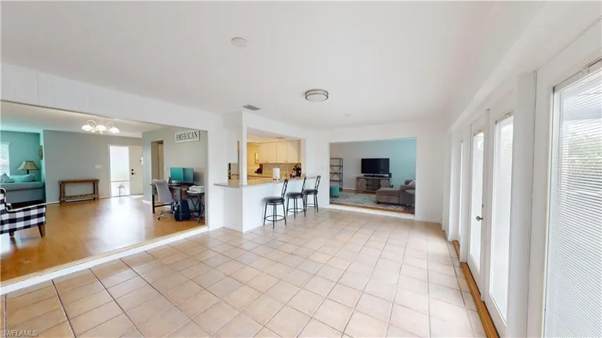 Florida Room with glass french doors to outside Lanai