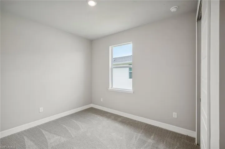 View of carpeted spare room
