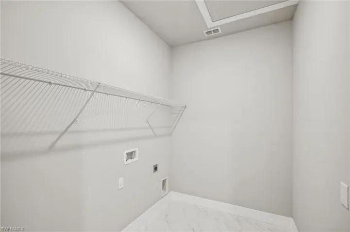 Laundry area with electric dryer hookup and hookup for a washing machine