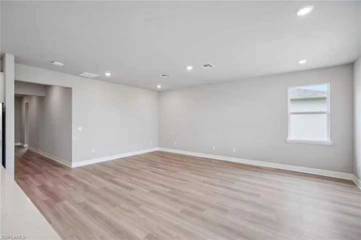 Spare room with light wood-type flooring