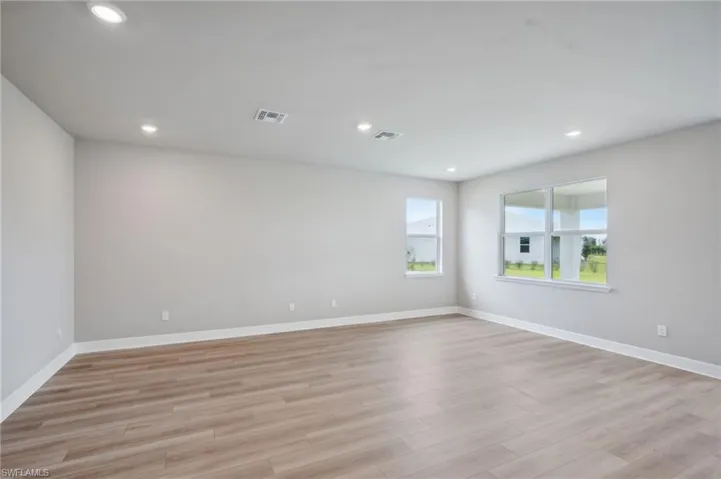 Empty room with light wood-type flooring