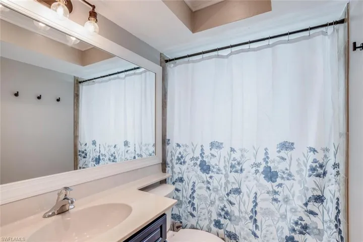 Master Bedroom with wood finished floors and ceiling fan