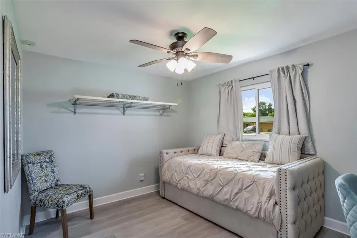 Bedroom with light wood-style flooring and ceiling fan