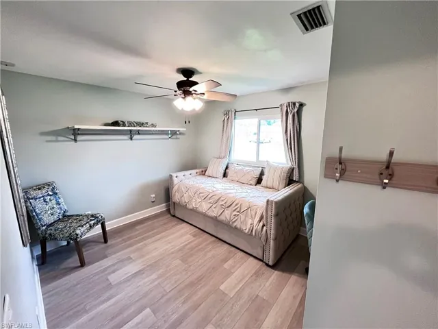 Bedroom with light wood-type flooring and ceiling fan