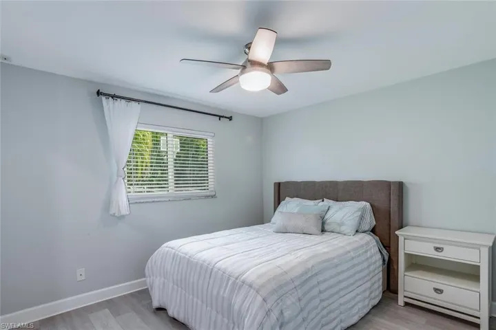 Living area with ceiling fan, light wood-style floors, recessed lighting, and ornamental molding