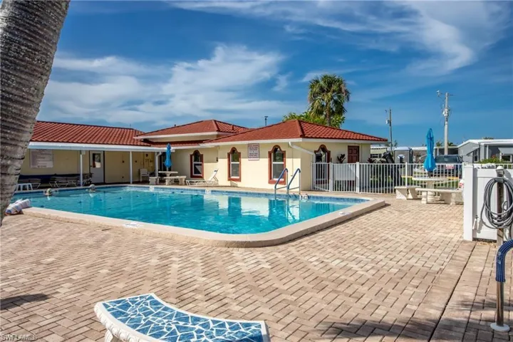 Community pool with a patio area