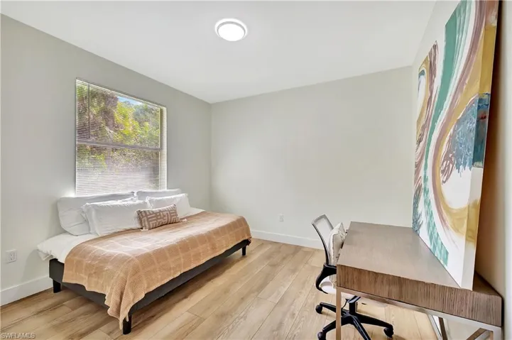 Bedroom with light hardwood / wood-style floors