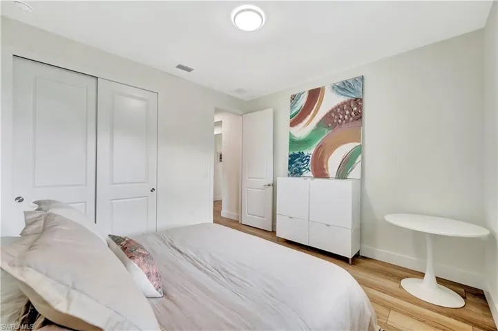 Bedroom featuring light hardwood / wood-style flooring and a closet